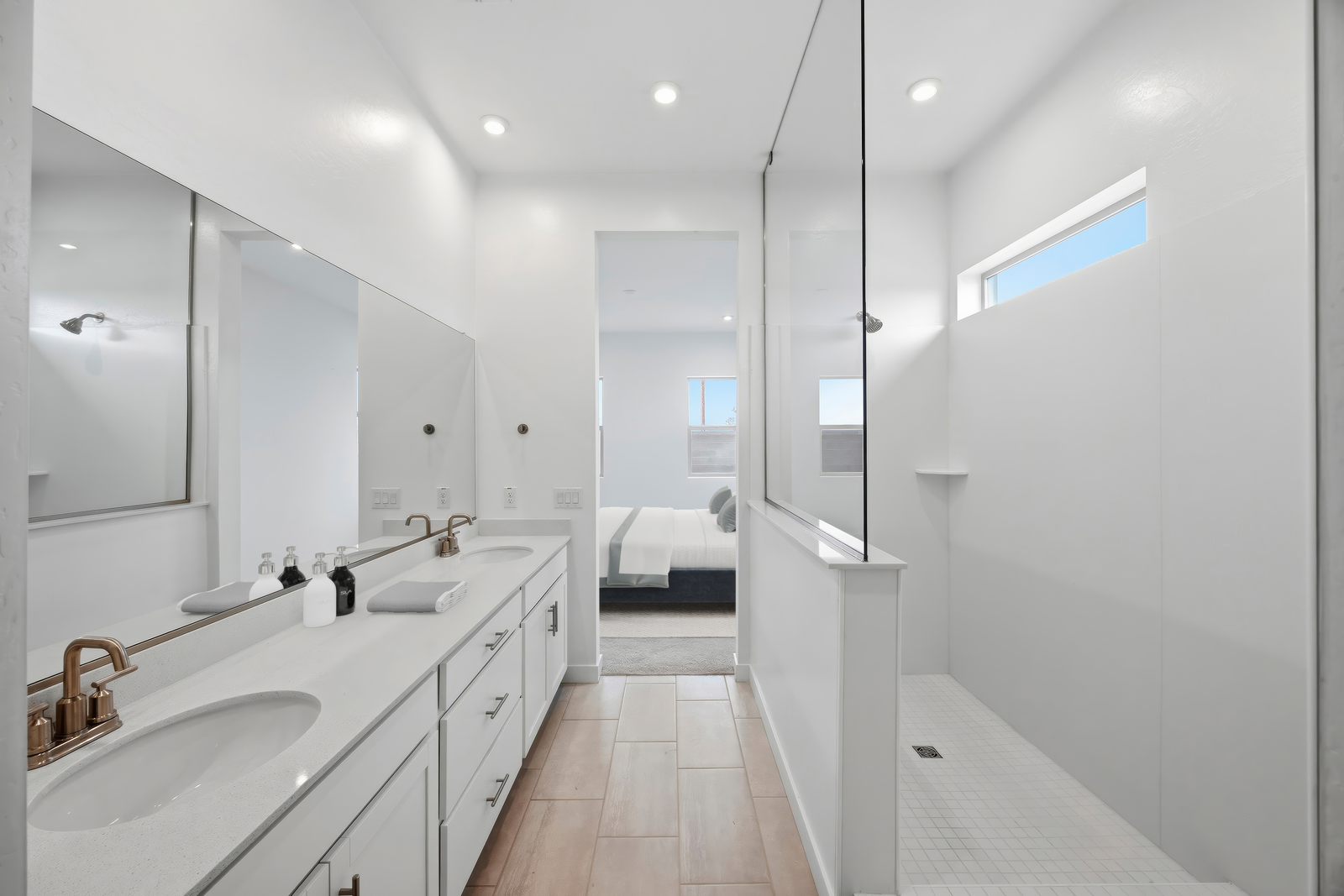 spacious bathroom with a large walk-in shower and double sink