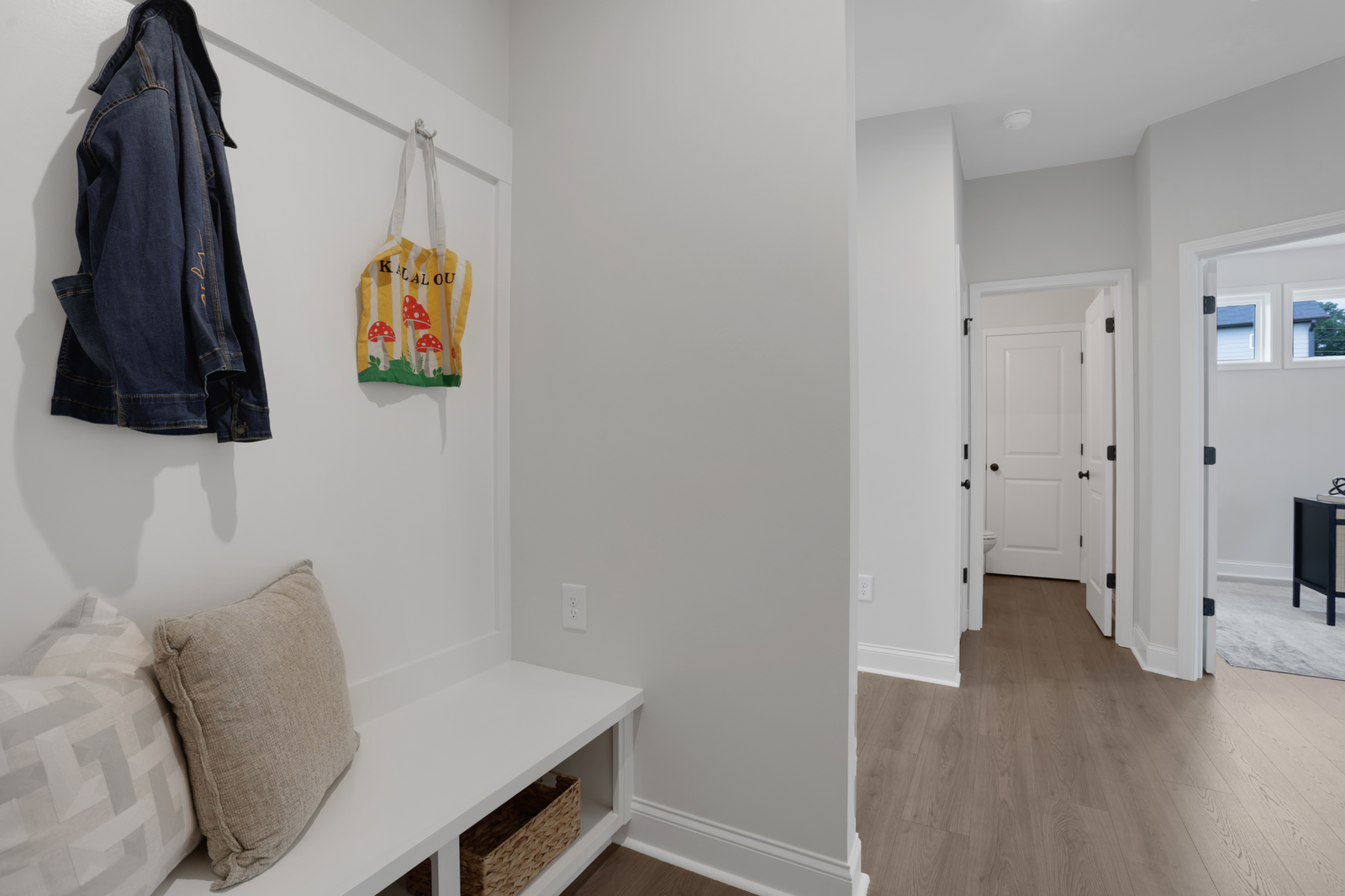 mud room with hard surface flooring and valet