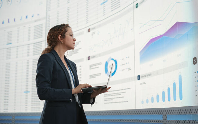 Businesswoman analyzing graph chart with tablet