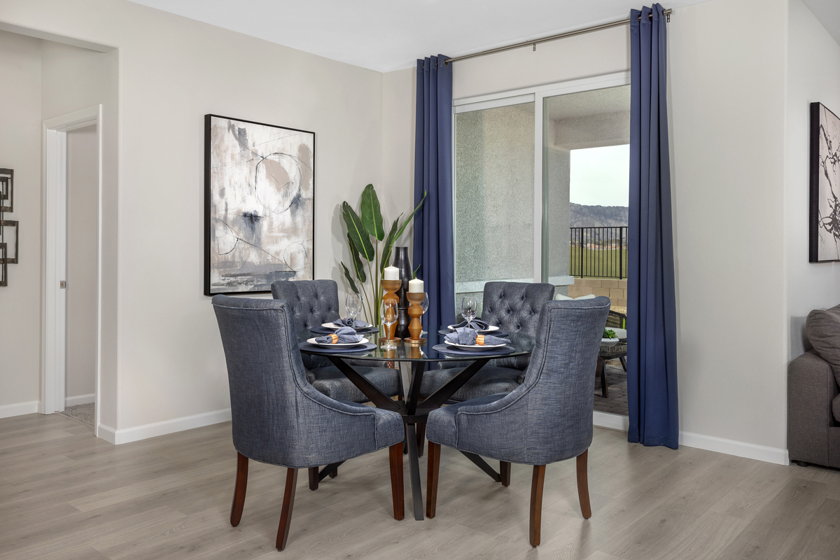 dining room with laminate wood flooring and table