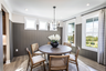 dining room with large windows and plank flooring
