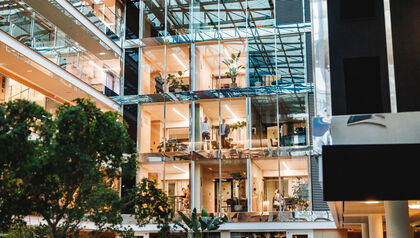 Diverse professionals engage in modern office environment