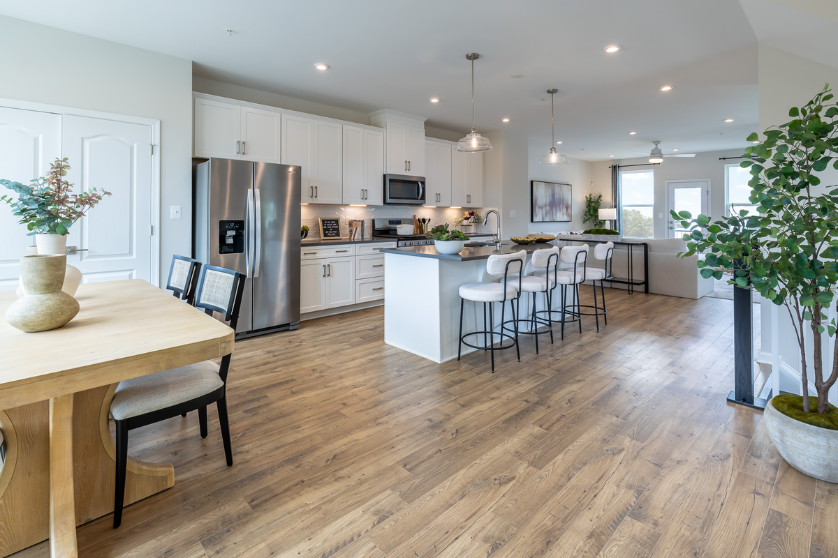 dining area with a wooden table & an open kitchen