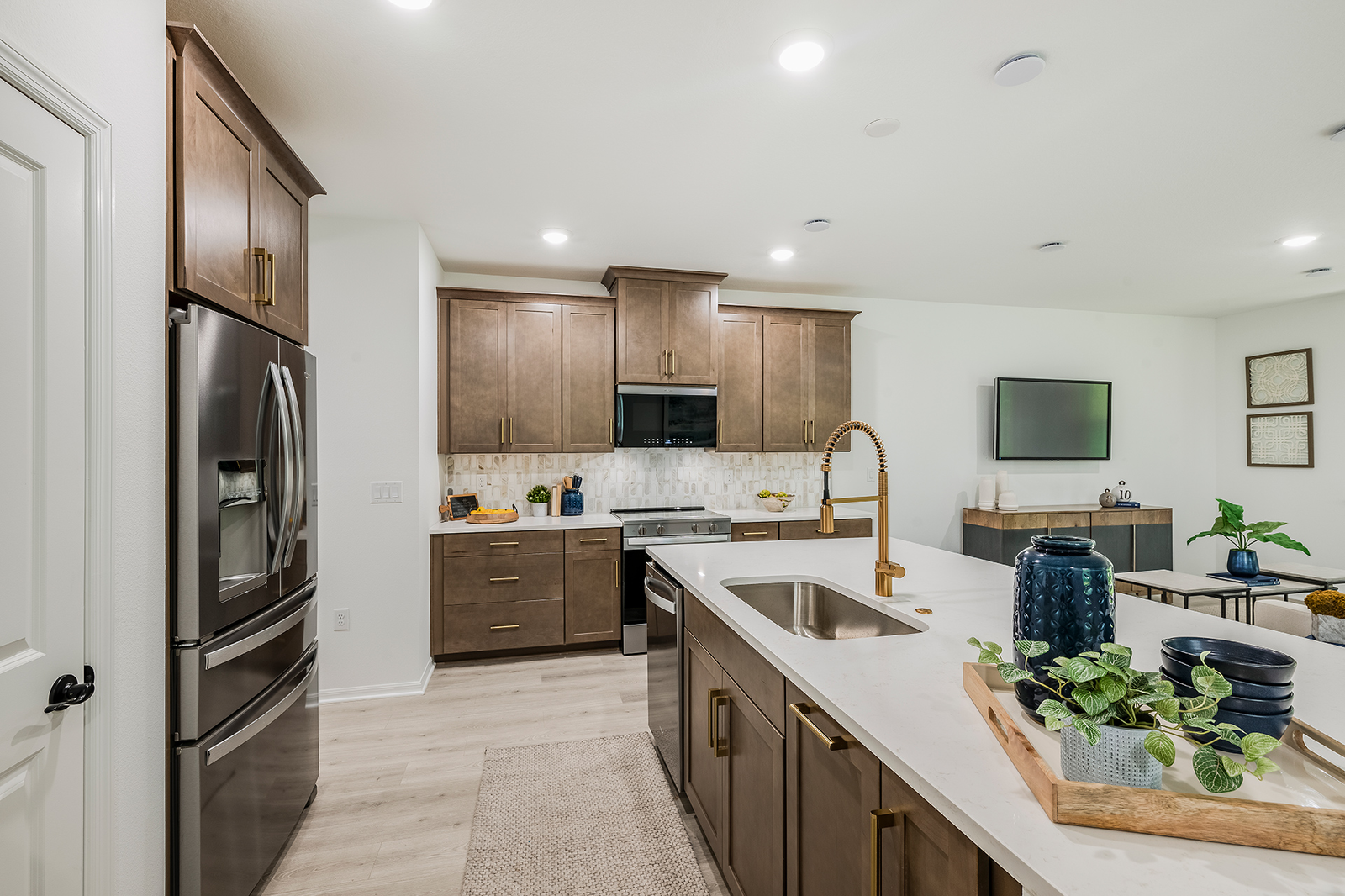 kitchen with brown cabinets and quartz countertops