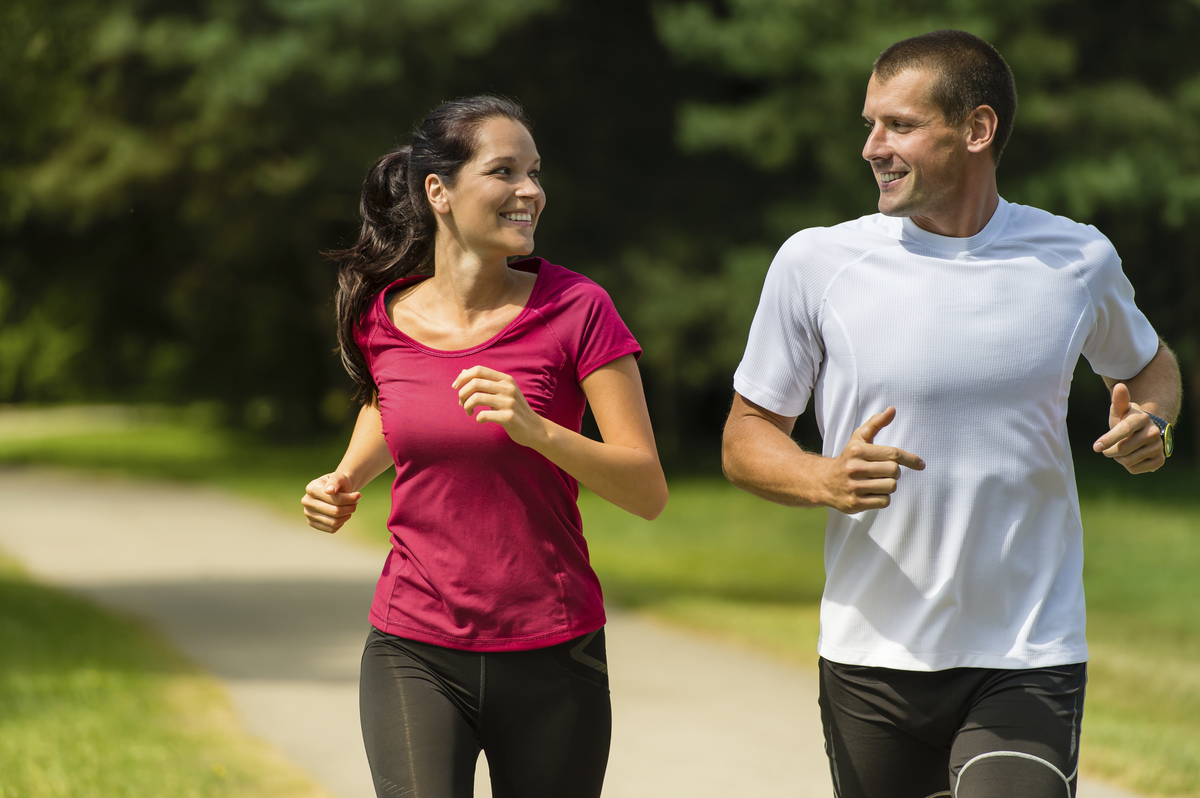 couple running on outdoor trail
