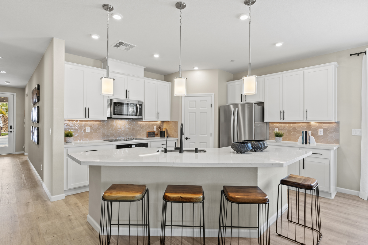 bright and open kitchen with white cabinets