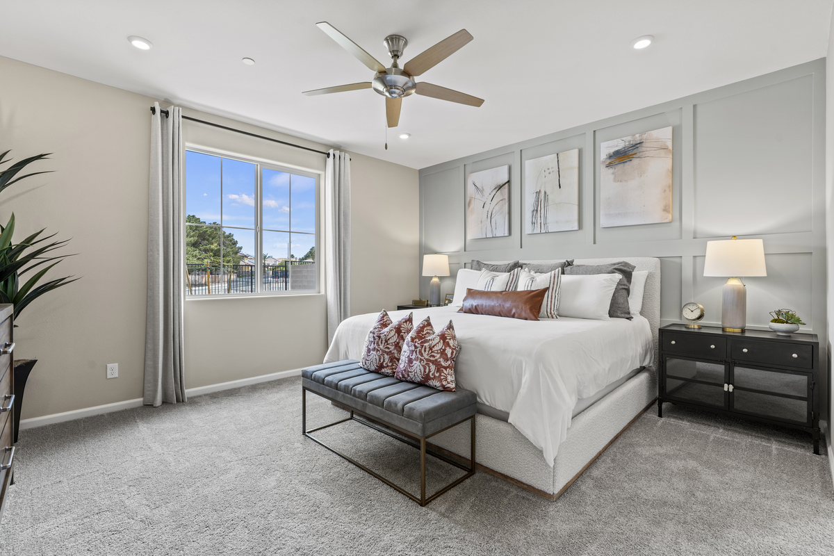 bright furnished bedroom with accent wall
