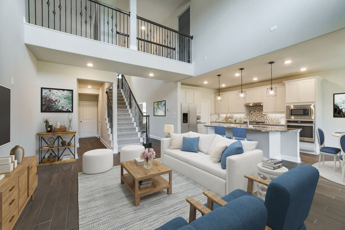 great room with wood-like tile and ceiling fan