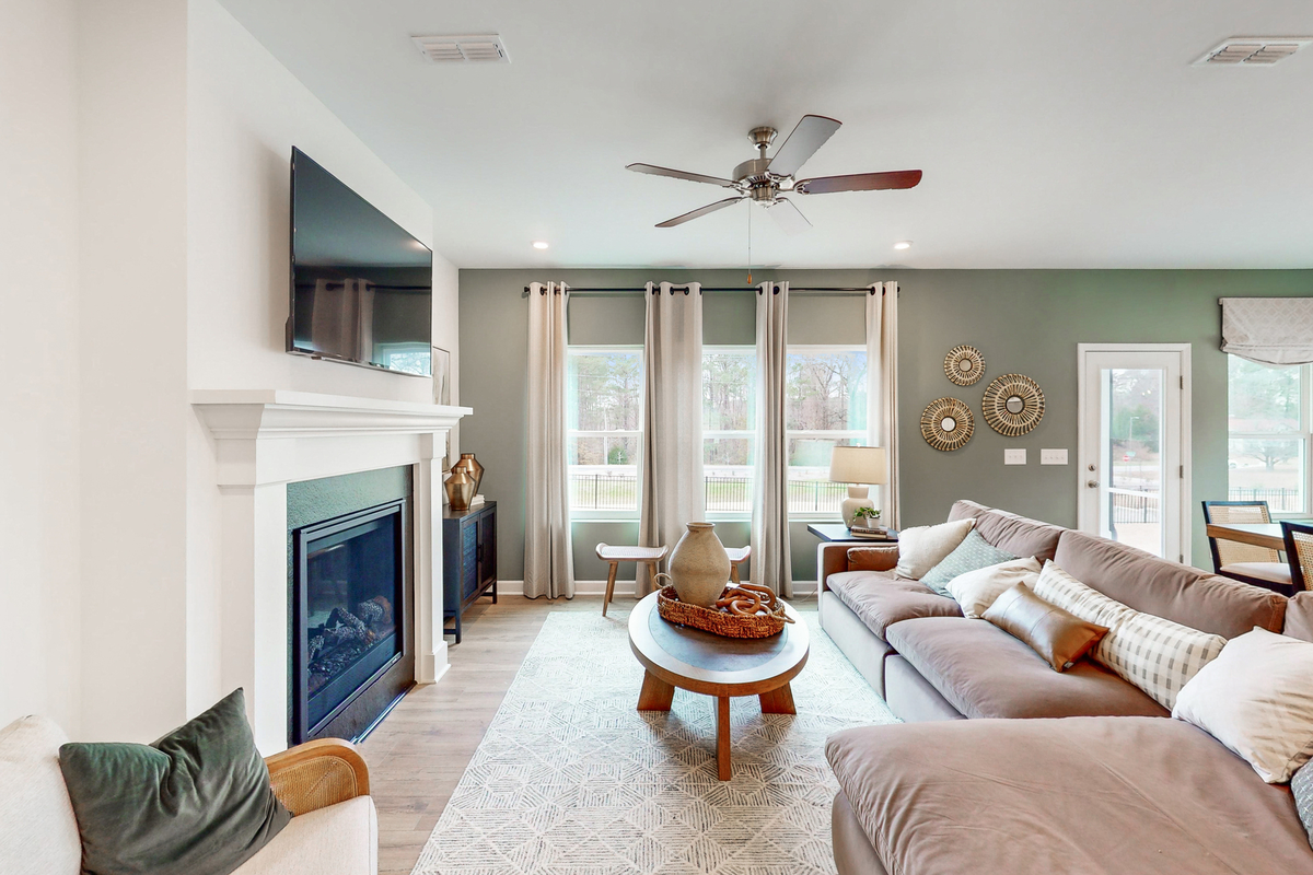 great room with fireplace and mounted tv above