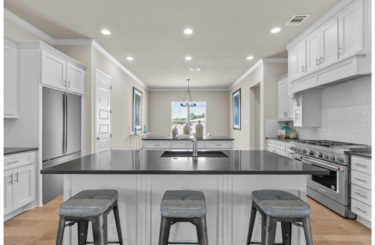 kitchen with two islands, a fridge & window