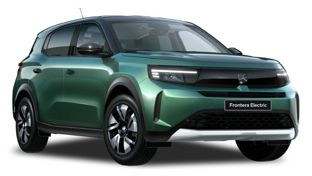 A green Vauxhall Frontera SUV parked outdoors on a gravel track, with green trees and cloudy sky in the background.