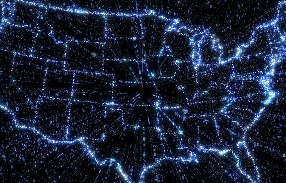 Glowing digital map of usa with exploding binary data