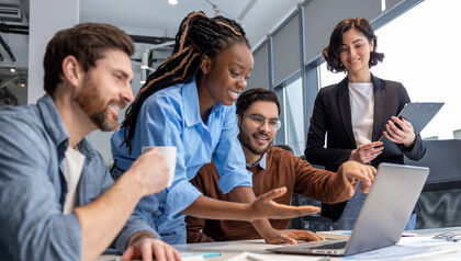 Group of diverse business people using laptop