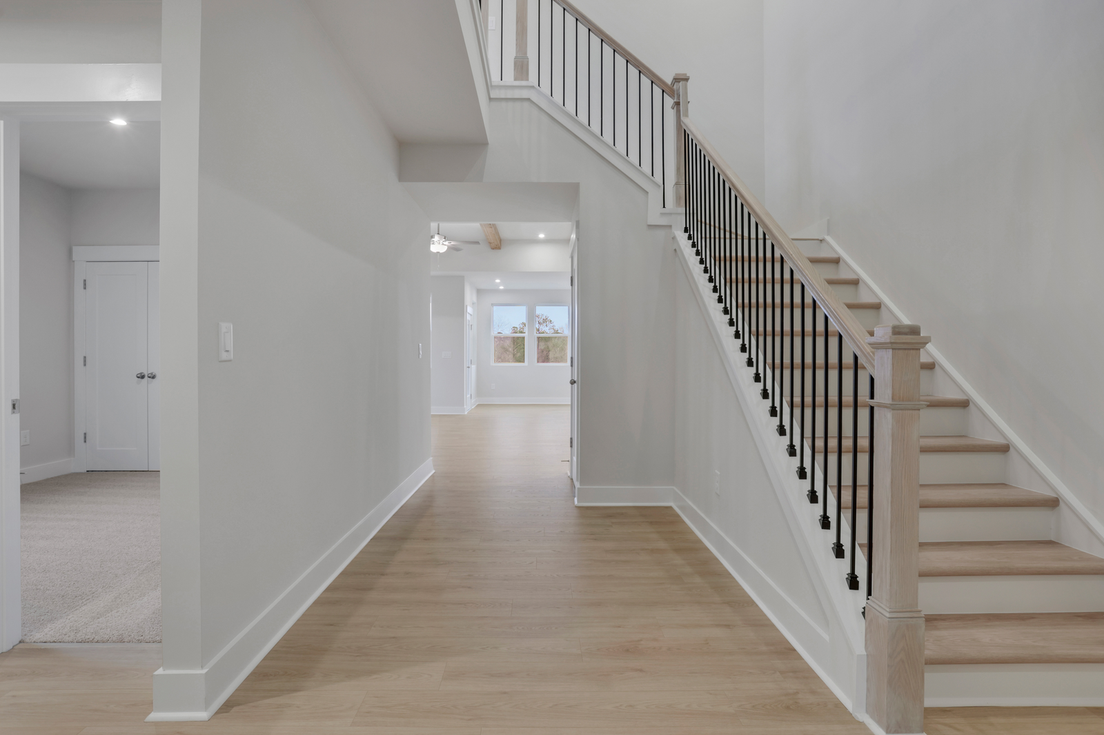 entryway with hard-surface flooring and 2-story foyer