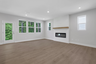 great room with electric fireplace and hard surface flooring