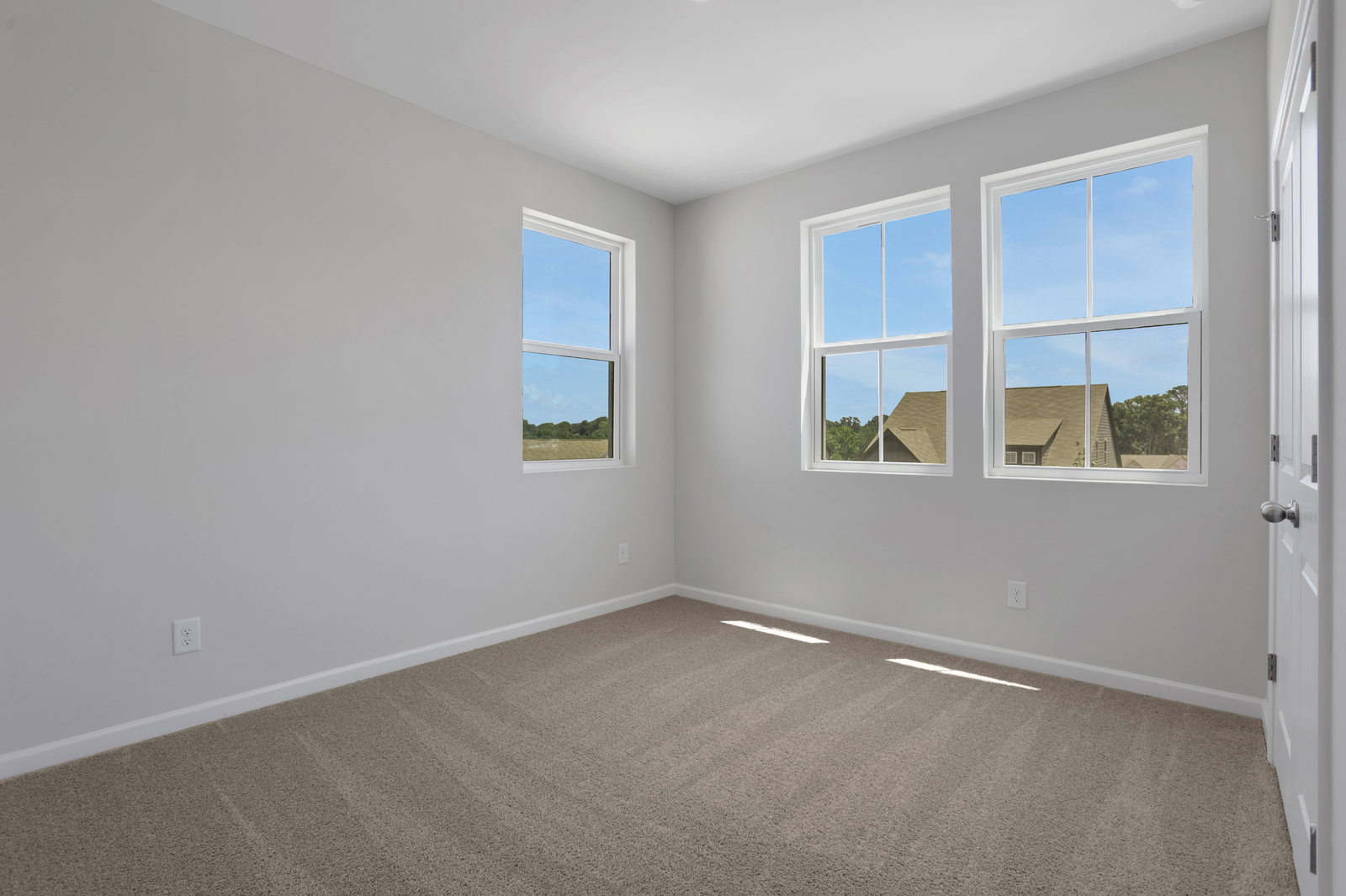 bedroom with windows and carpet