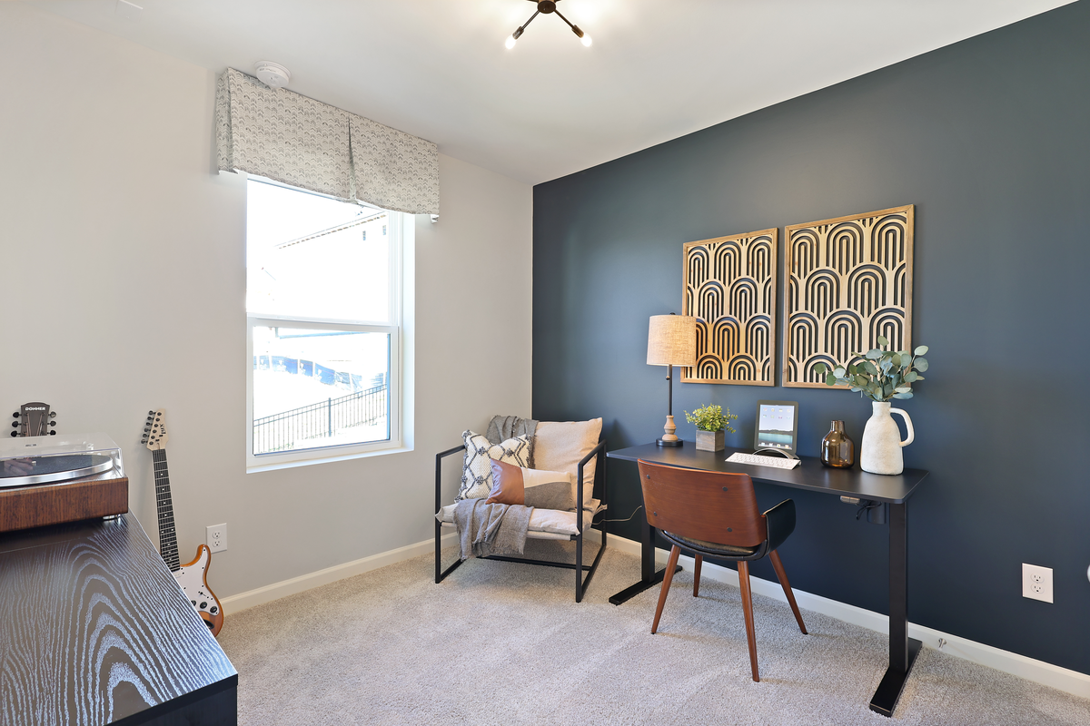 light-filled bedroom with carpet flooring 