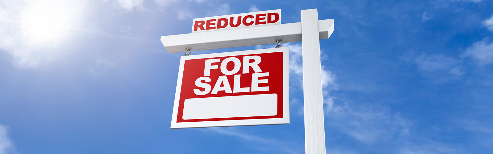 For sale sign with price reduced notice