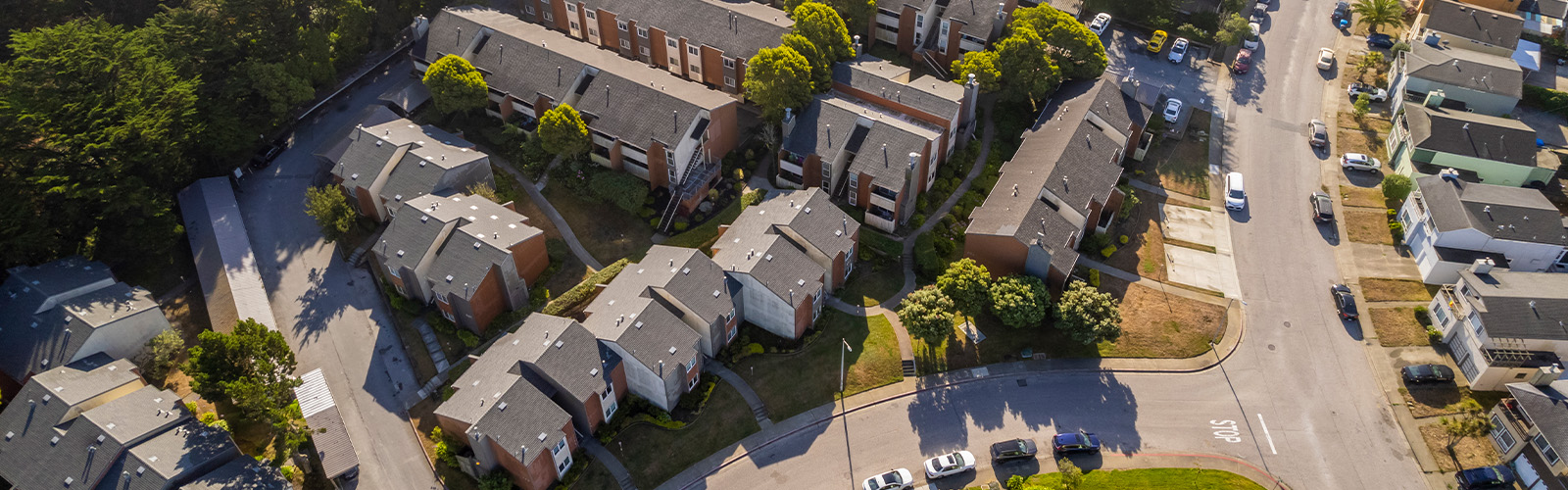 An aerial view of a neighborhood with different properties