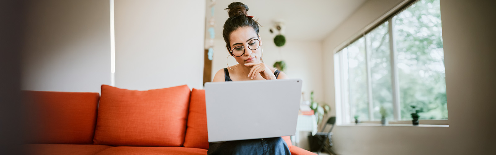 A woman sitting with a laptop