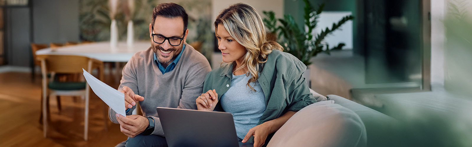 A happy couple discussing their finances