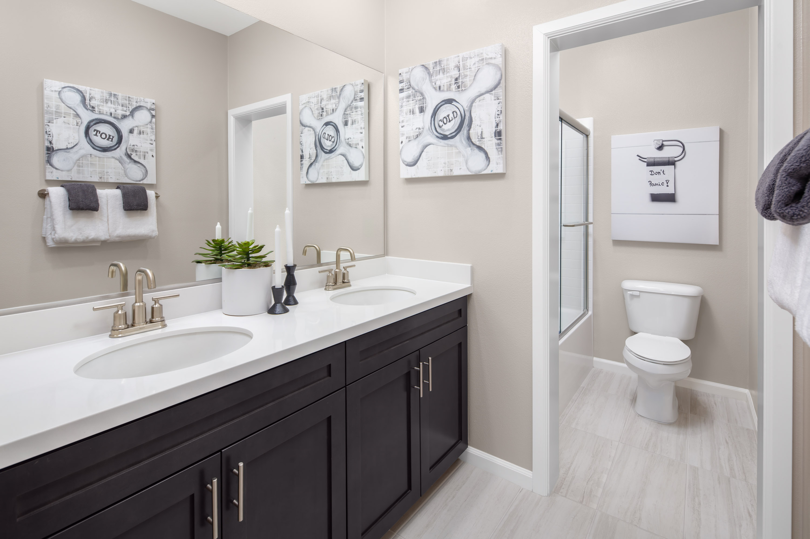 bathroom with neutral tile floors and white countertops