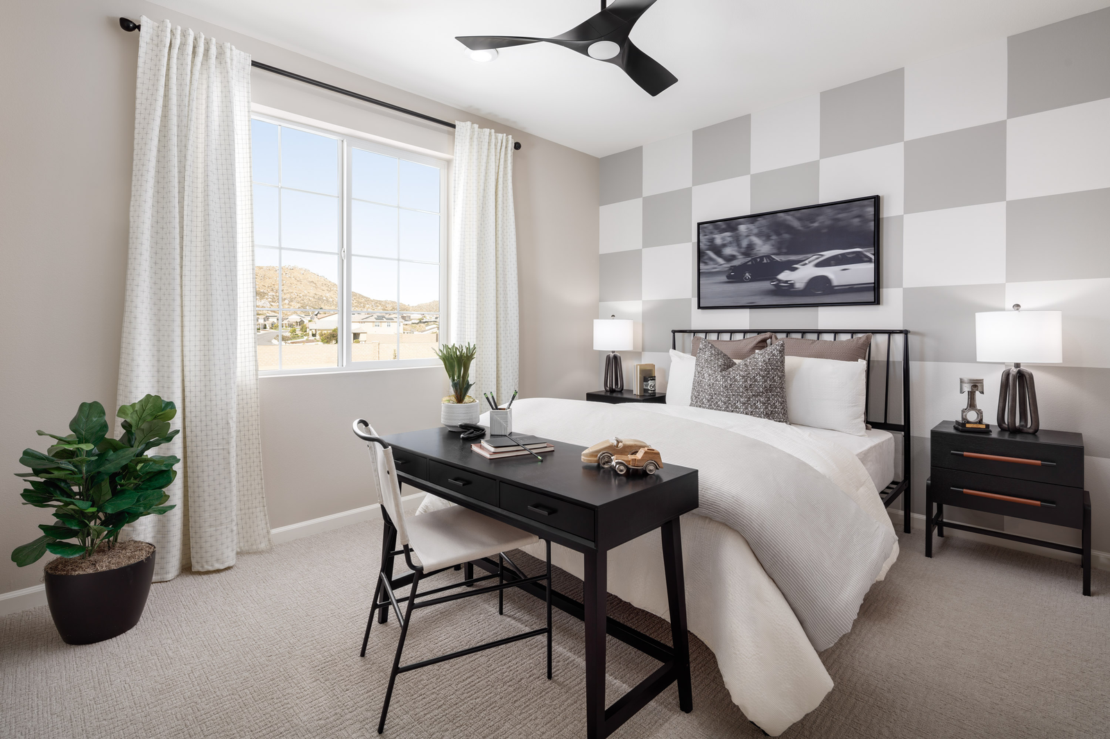 bedroom with neutral floors and accent wall