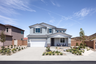 exterior of two-story home with desert landscaping and white garage