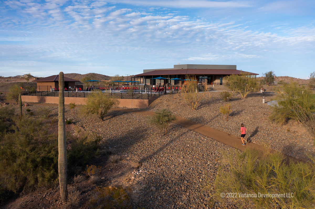 person using a desert hiking trail at dusk
