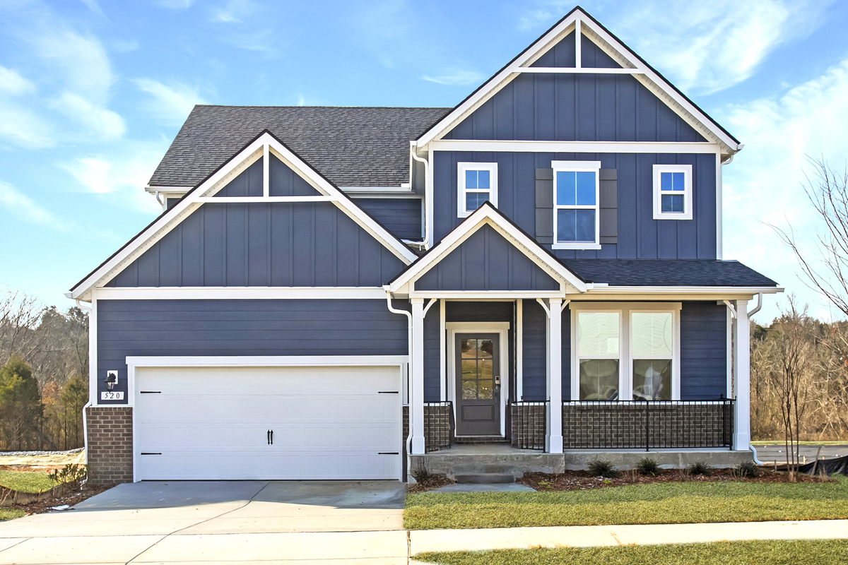 exterior of home with dark brick and blue siding