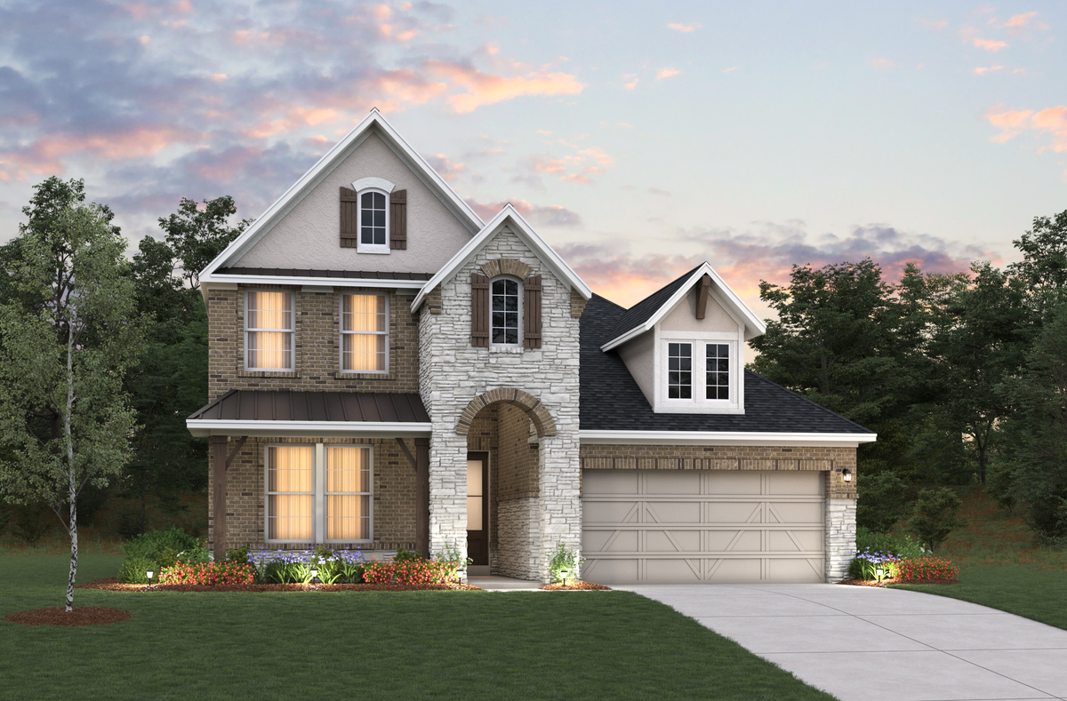 Two-story home with brick dusk sky