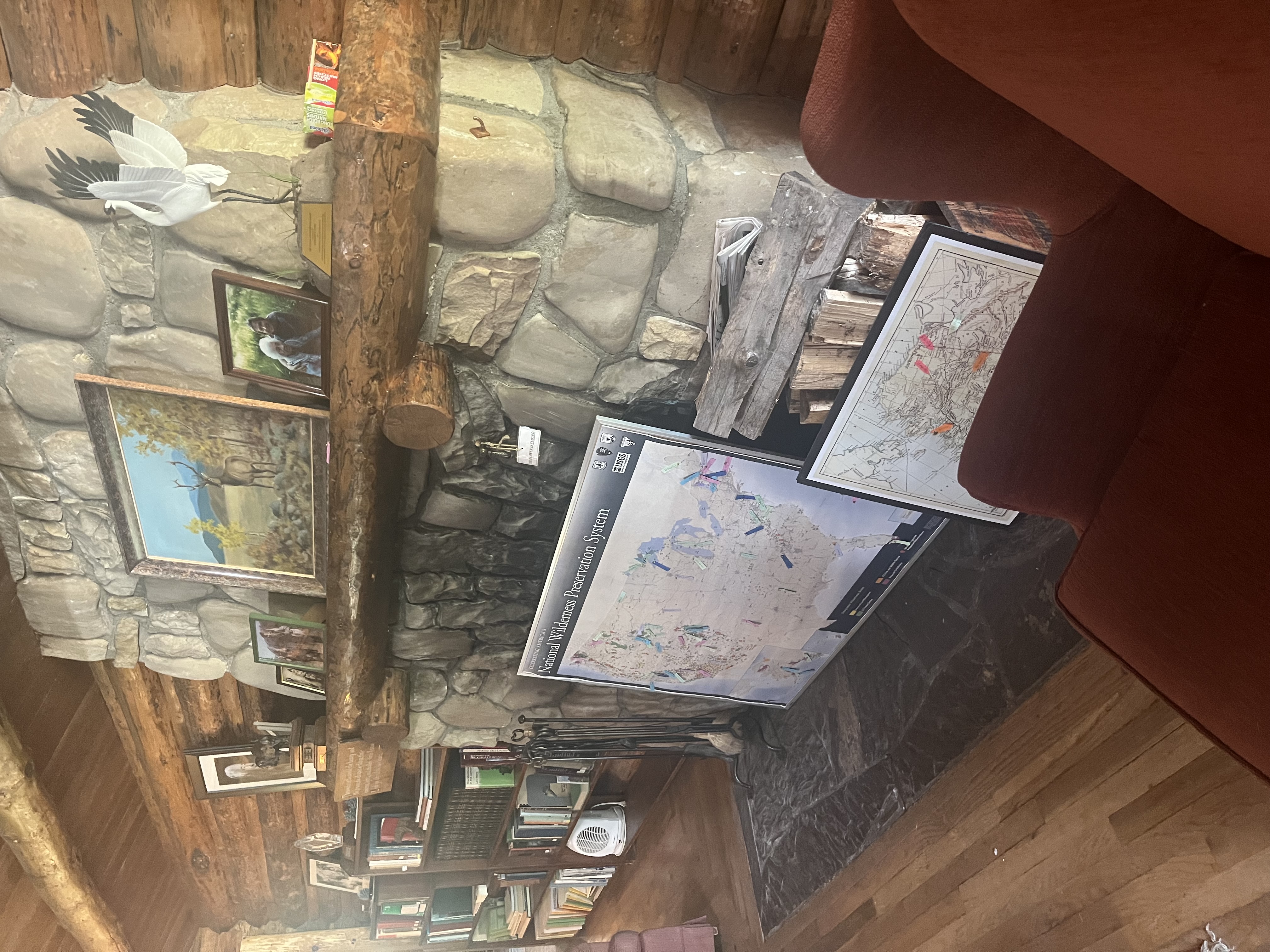 The stone fireplace inside the Murie Residence