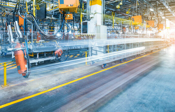 Blurred image of a industrial manufacturing plant and machinery