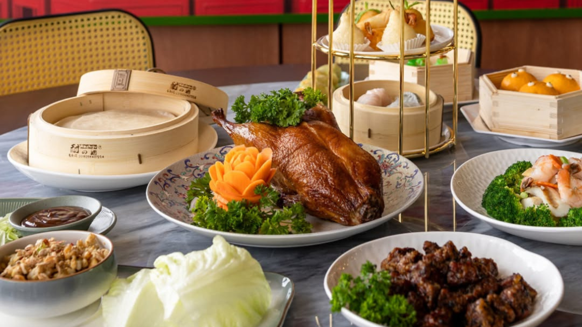 Elegant Chinese dining spread with roast duck, dim sum and seafood dishes