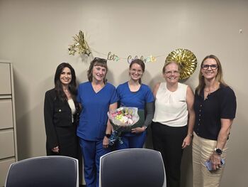 Jenna Hogberg celebrates her 2026 midyear DAISY Award with Moffitt leaders at Moffitt McKinley Outpatient Center.