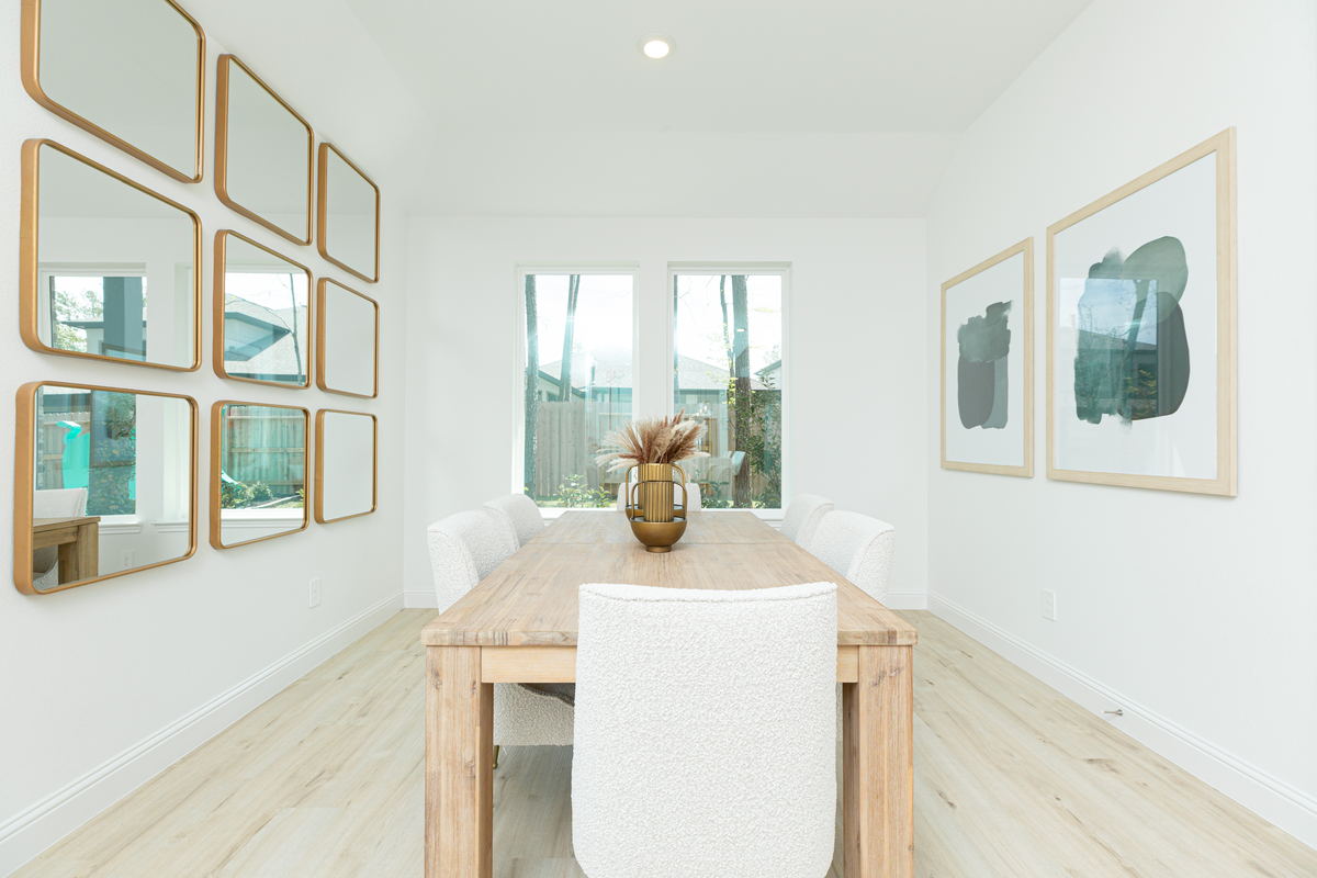 wooden dining table with chairs and mirror decor
