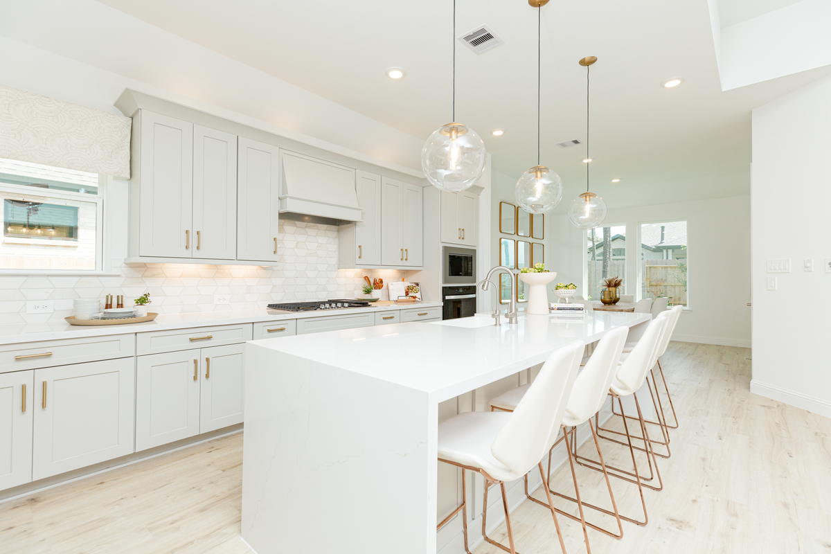 gray and white kitchen with oversized island