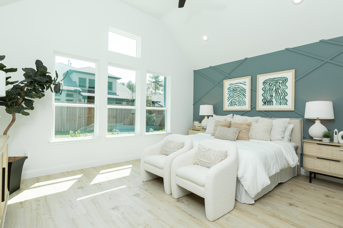 primary bedroom with accent green wall