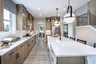 kitchen with large center island and wood-finish cabinets