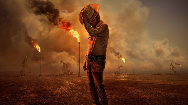 Promotional image for Landman showing a lone oil worker surrounded by burning oil rigs in West Texas