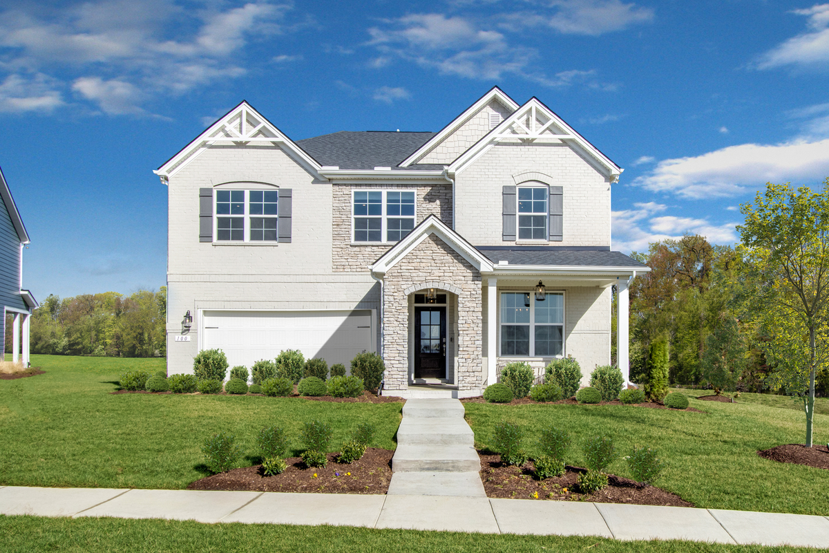 exterior home with brick and stone front porch