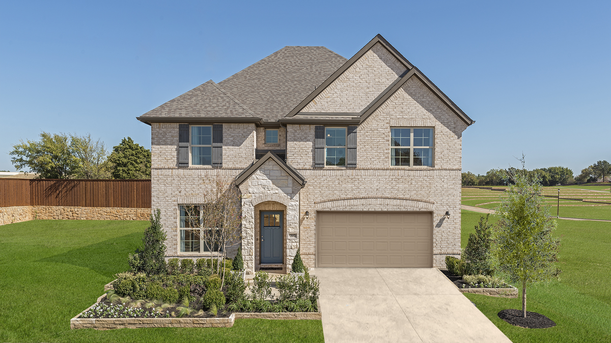 two-story home with brick and stone exterior