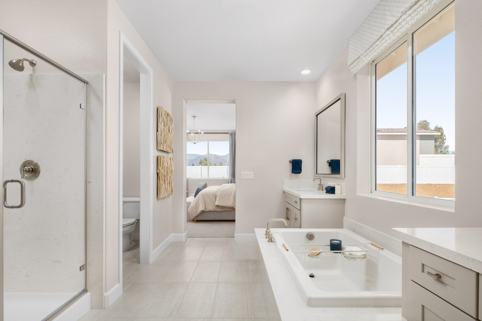 A spacious bathroom with tub and shower