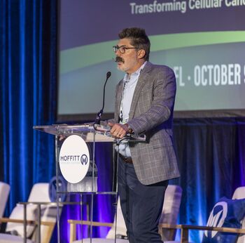 Photo of Dr. Fred Locke on stage at the podium at Cell Coast 2026
