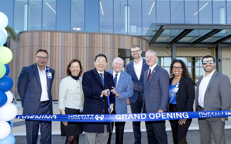 Chief Operating Officer Sabi Singh; Physician in Chief Karen Lu, MD; President and CEO Patrick Hwu, MD; Founder H. Lee Moffitt; Vice President of Ambulatory and Virtual Care Operations Matt Bednar; Board Chair Timothy Adams; Director of Nursing and Ambulatory Operations Jazmin Calzada; and Justin Menendez, project manager for Whiting-Turner, celebrate the grand opening of Moffitt at SouthShore in January 2025.