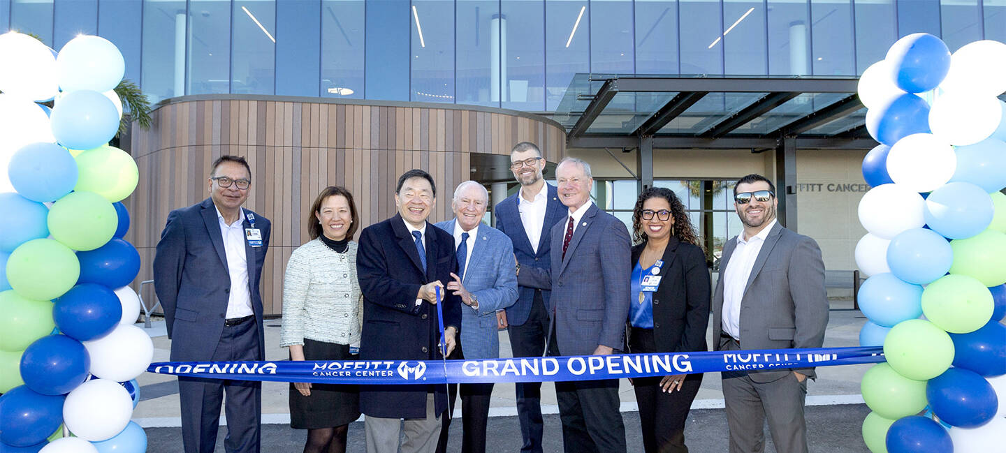 Chief Operating Officer Sabi Singh; Physician in Chief Karen Lu, MD; President and CEO Patrick Hwu, MD; Founder H. Lee Moffitt; Vice President of Ambulatory and Virtual Care Operations Matt Bednar; Board Chair Timothy Adams; Director of Nursing and Ambulatory Operations Jazmin Calzada; and Justin Menendez, project manager for Whiting-Turner, celebrate the grand opening of Moffitt at SouthShore in January 2025.