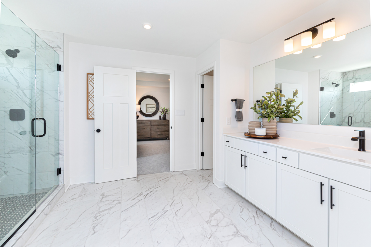 primary bathroom with tiled shower 