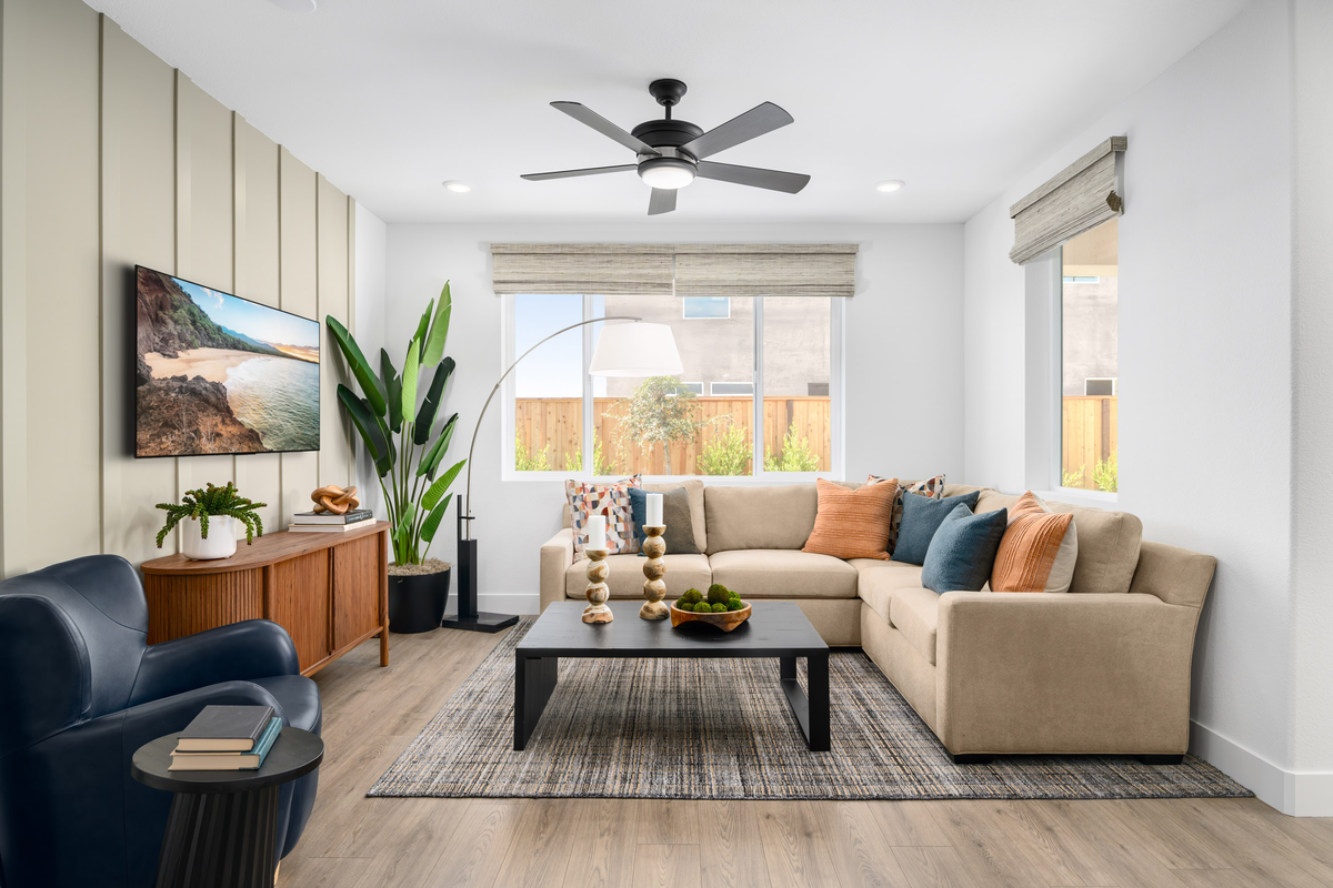 Bright great room with warm accent wall and décor