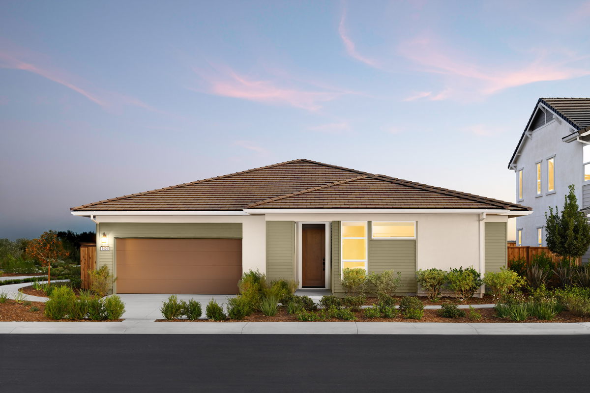 front of sage green & brown house