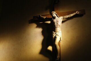 Evening light shines on a crucifix